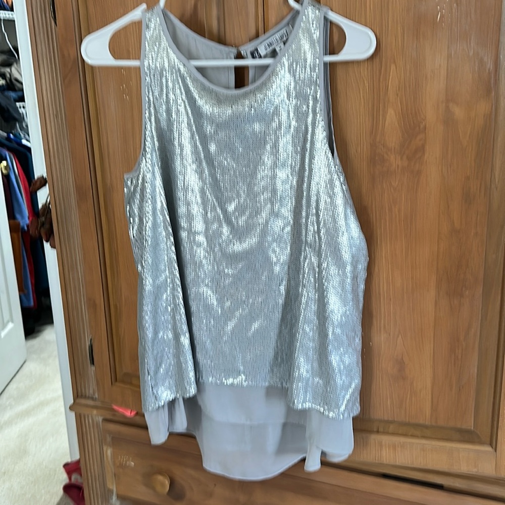 Jennifer Lopez silver sequin tank top with sheer gray layer underneath